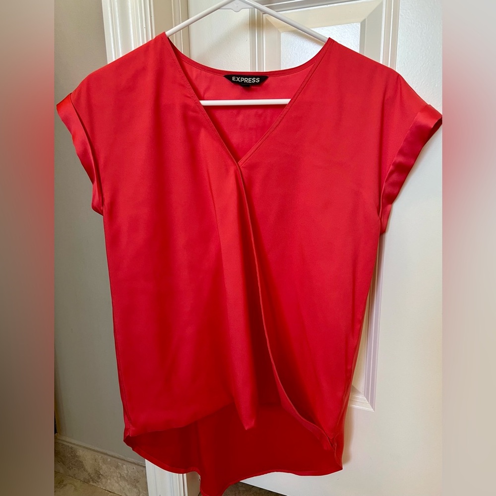 Express London tee satin blouse with crossing front, longer in back than front.